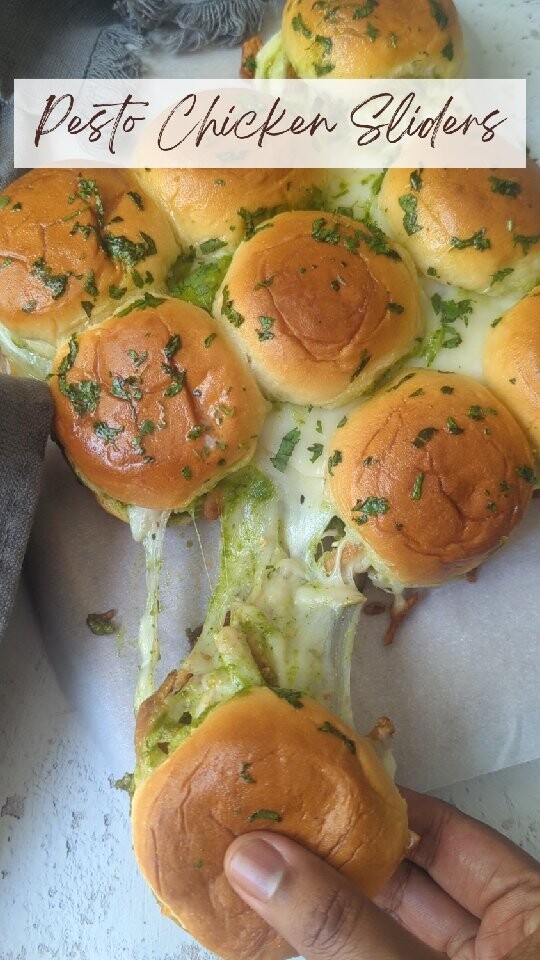 Pesto Chicken Sliders sundaysliders kingshawaiianThese hot and melty Pesto Chicken Sliders are topped with a buttery mixture of seasonings and baked until warm and toasty. Easy, fast, and a family favorite!

This easy slider recipe is so perfect for a crowd. They also make a great game day appetizer, a Super Bowl party food or an easy dinner on a weeknight! You can pair them with some fries or chips for a complete meal. 

I have used kingshawaiian Slider buns, they are so perfect rolls for making hot cheesy sliders! The touch of sweetness and that soft interior is perfect here! 

Simply slather pesto on the buns and top it with shredded grilled chicken and brush the top of the rolls with melted butter! Then, just add them to a baking dish and put them in the oven to let them get toasted with melty cheese.

chickensliders sliders sundayfunday grilling summervibes pestochicken pesto pestochickensliders pullapartsliders chickenpullapart trending viralreels recipeoftheday reelsitfeelsit